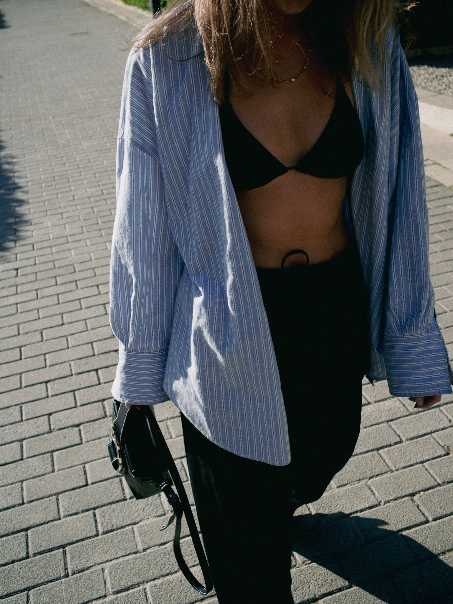 The timeless triangle bikini with oversized shirts